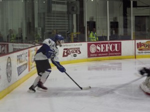Saratoga defenseman Cam McCall makes a pass from behind the goal in the second period.