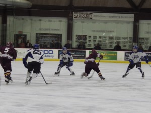 A BH-BS player attempts to get the puck past Saratoga's defense during the third period.