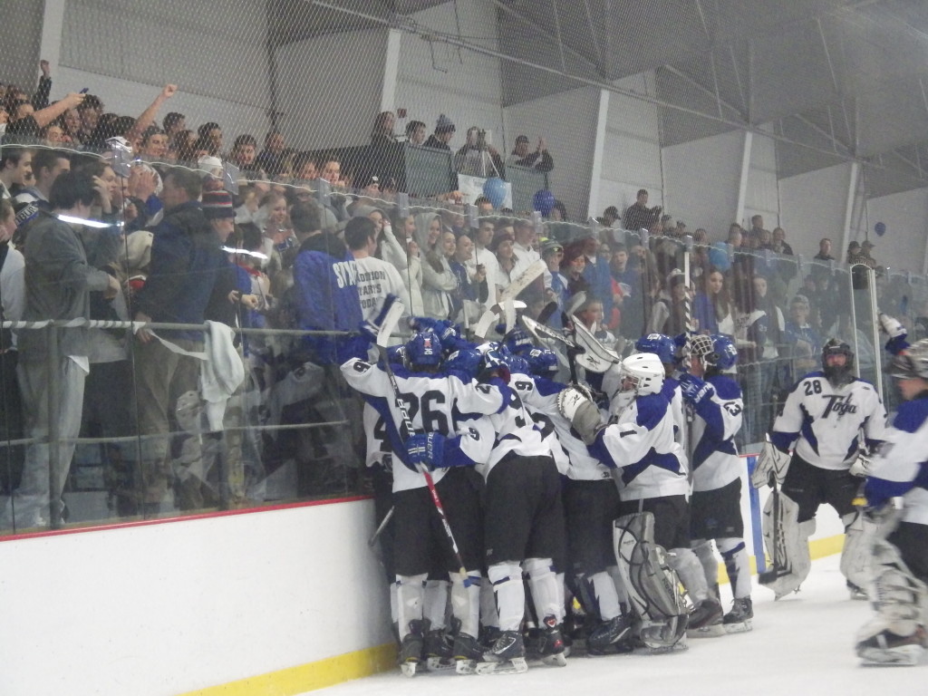 The triumphant Blue Streaks celebrate at the end of Thursday's game after a 5-1 win over Shenedhowa.